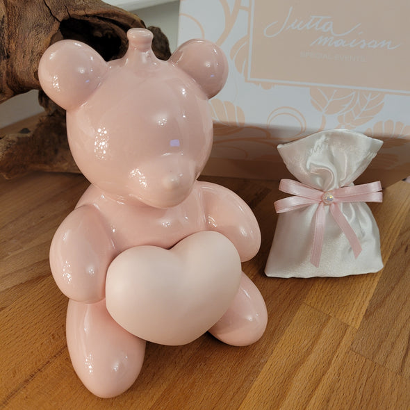 Orso salvadanaio in porcellana rosa lucida con cuore satinato