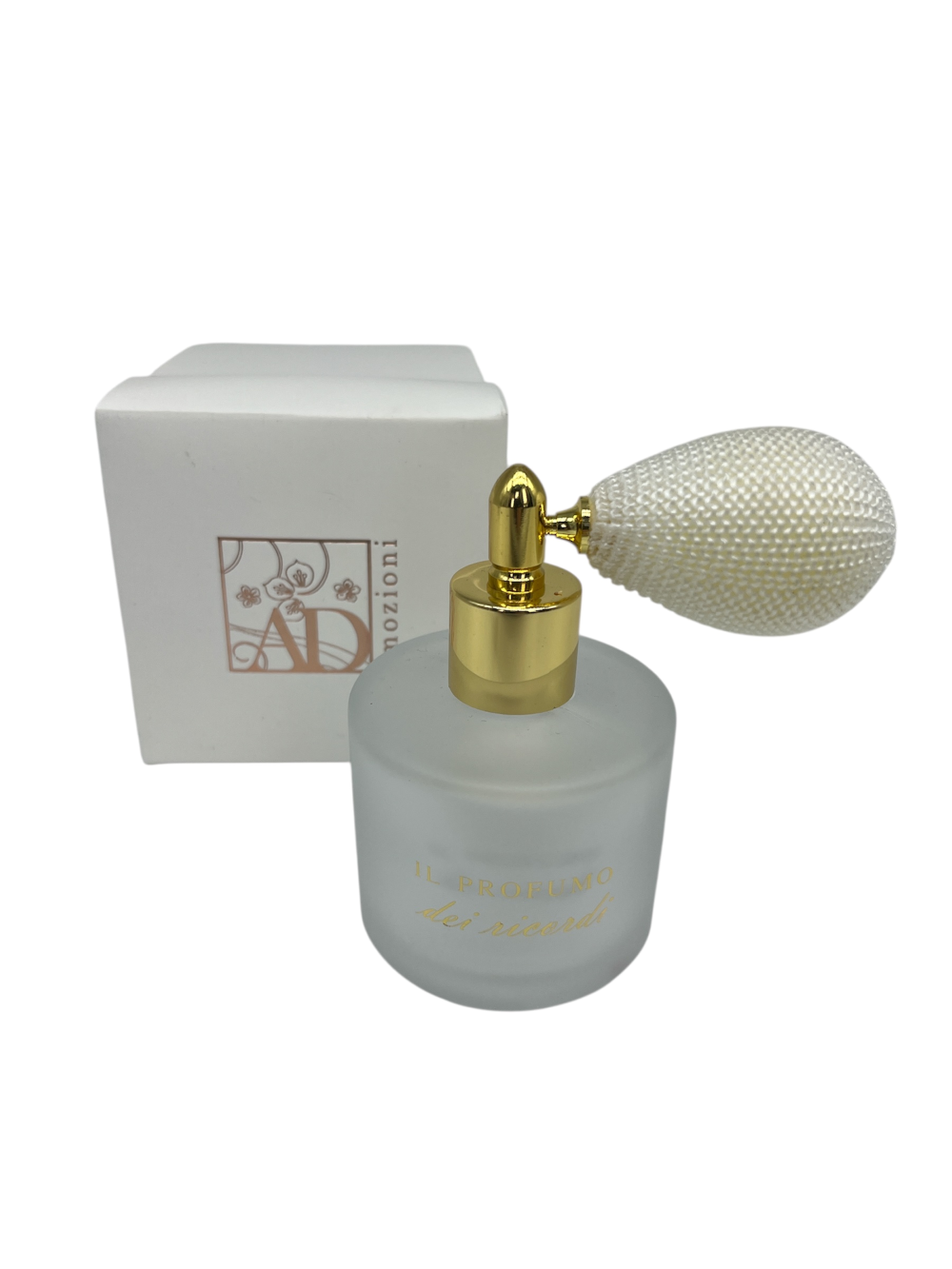 Fragranze colorate: portaprofumo bianco con spray e scritta dorata