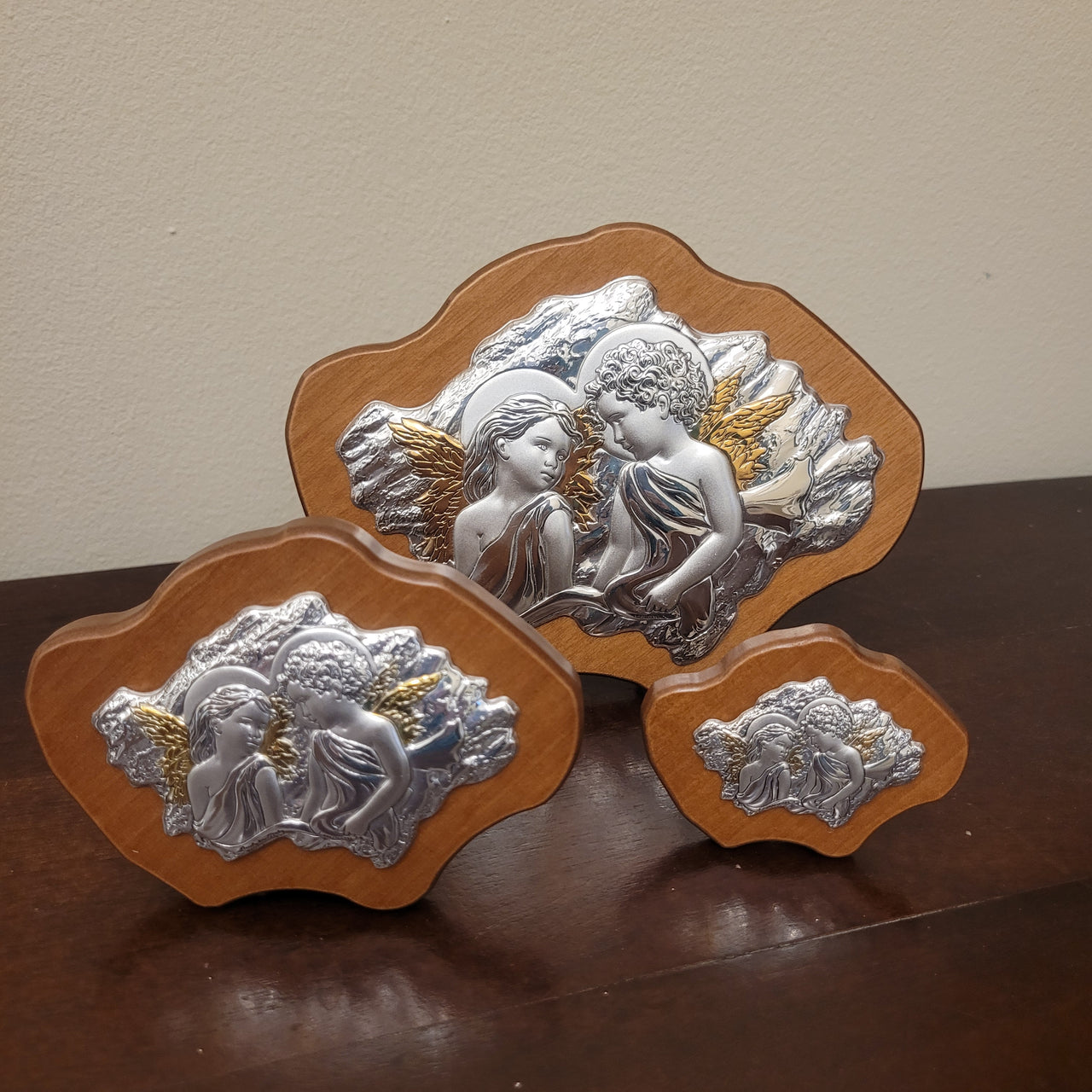 Tris di pannelli in argento e legno con Angeli